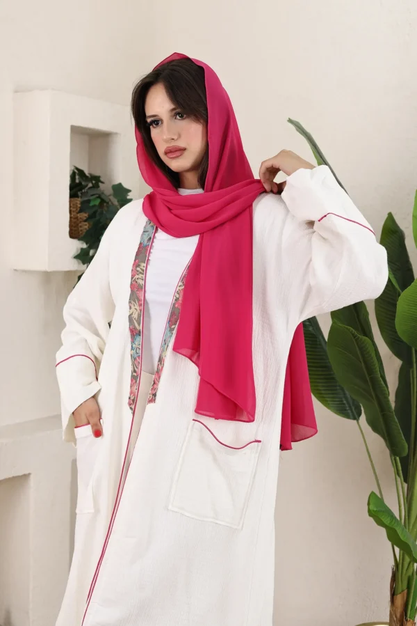 White Linen Abaya with Floral Trim and Pink Scarf - Image 2
